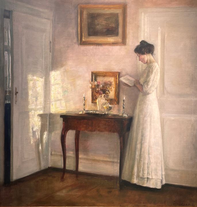 Carl Vilhelm Holsøe - A lady reading in an interior | MasterArt